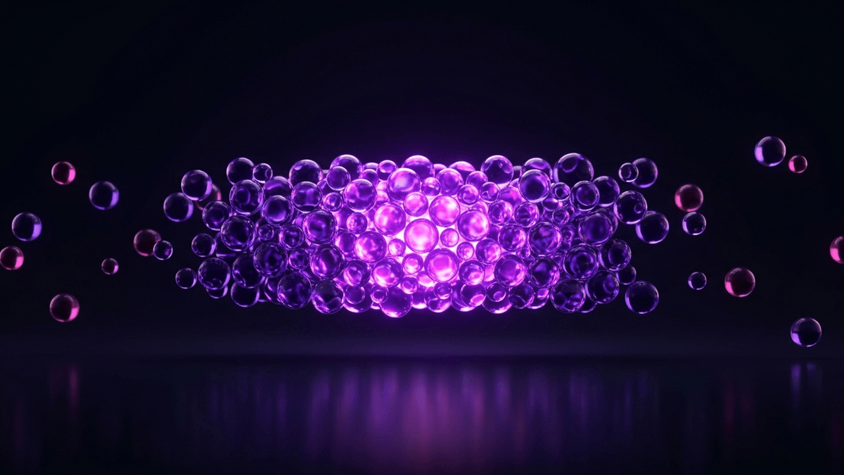 Most glass spheres packed into one narrow bright band, a few stragglers scattered far out