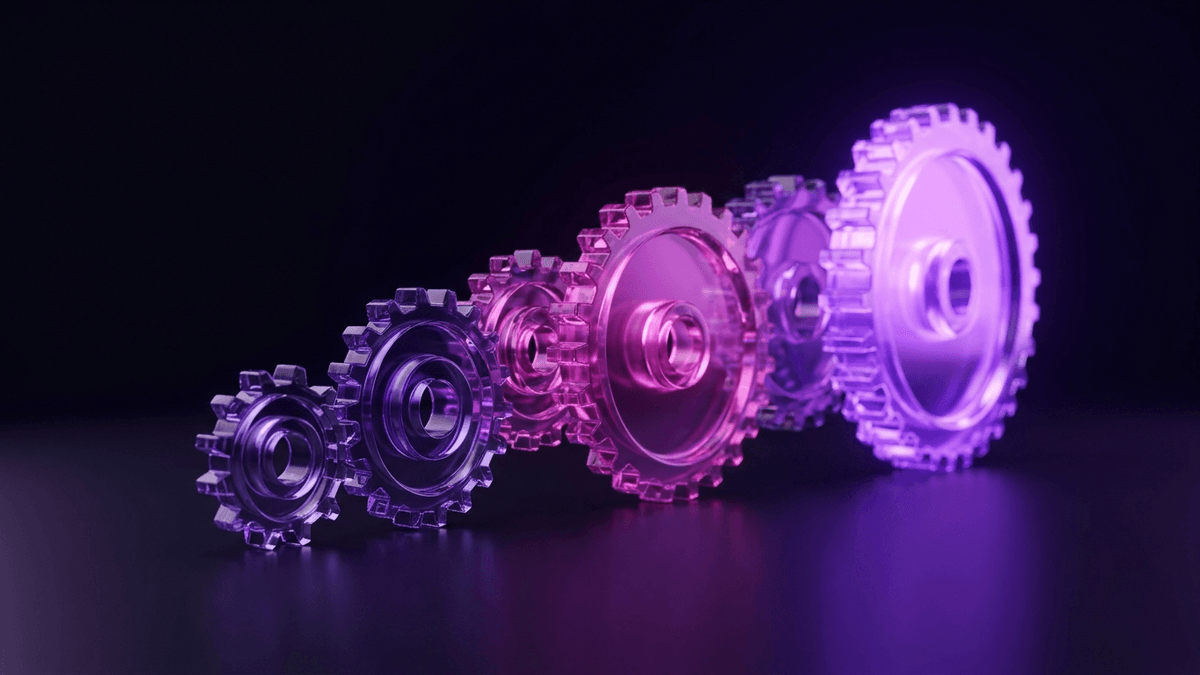 Interlocking glass gears turning a small input into a wide bright output wheel